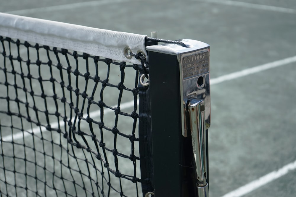 a close up of a tennis net on a tennis court