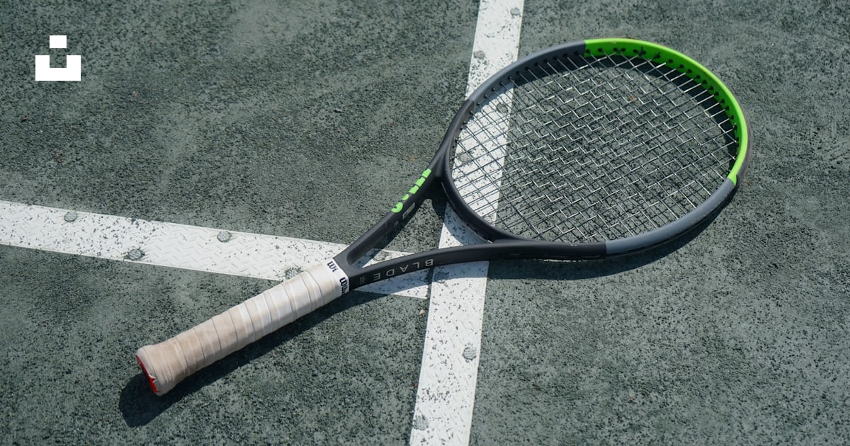 A tennis racket laying on a tennis court photo – Free Royal south yarra ...