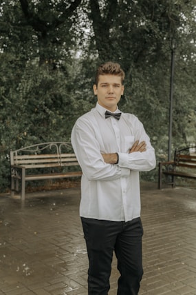 a man in a white shirt and bow tie