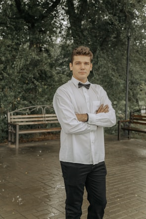 a man in a white shirt and bow tie