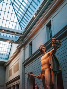 Minimalist neoclassical statue in a modern, bright office space