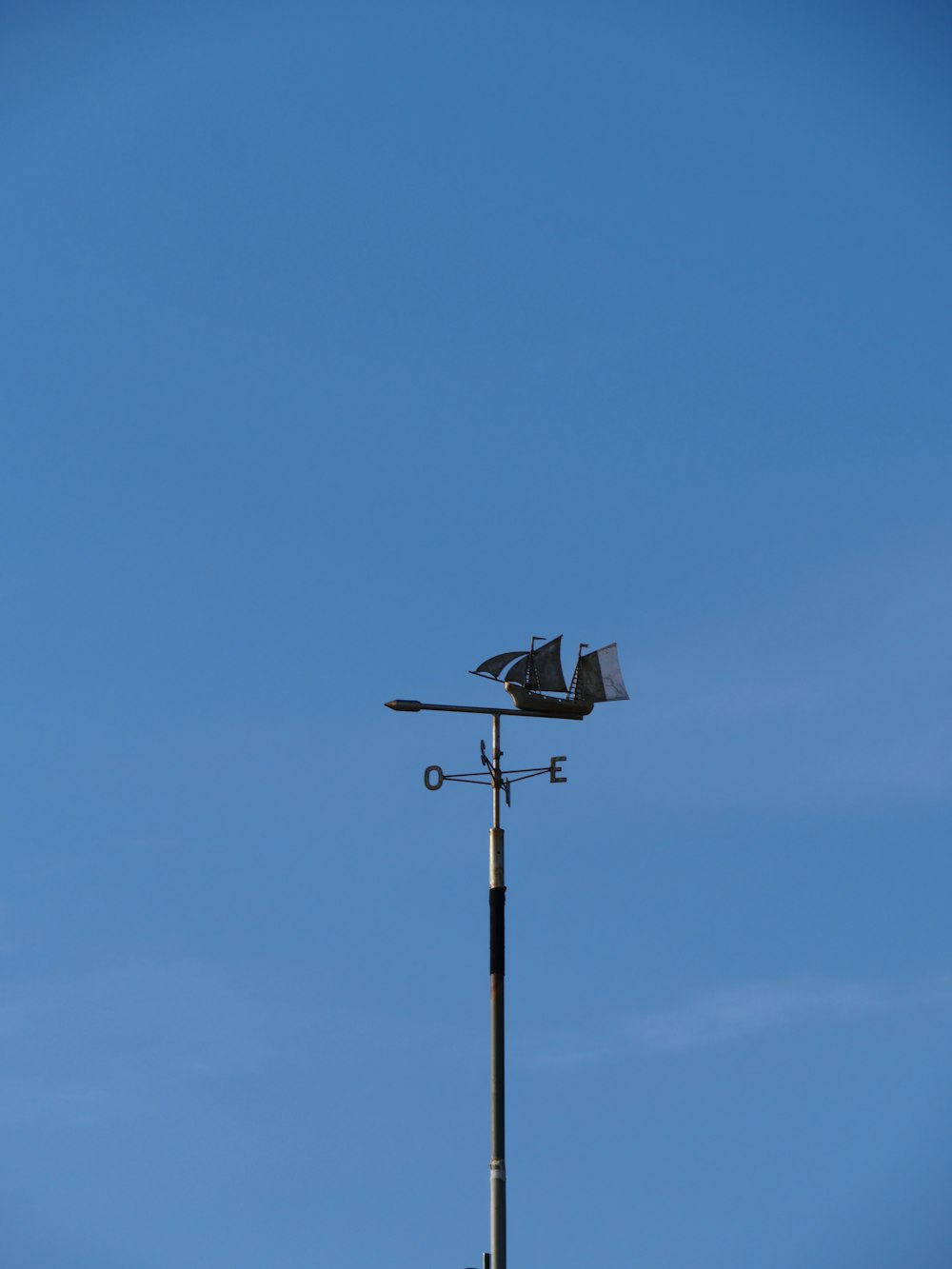 a weather vane on top of a weather vane