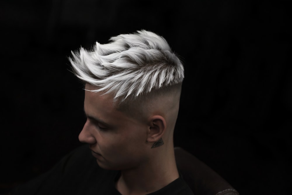 a young man with a white mohawk undercut