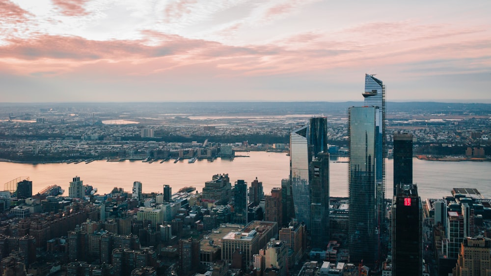 an aerial view of a city and a body of water