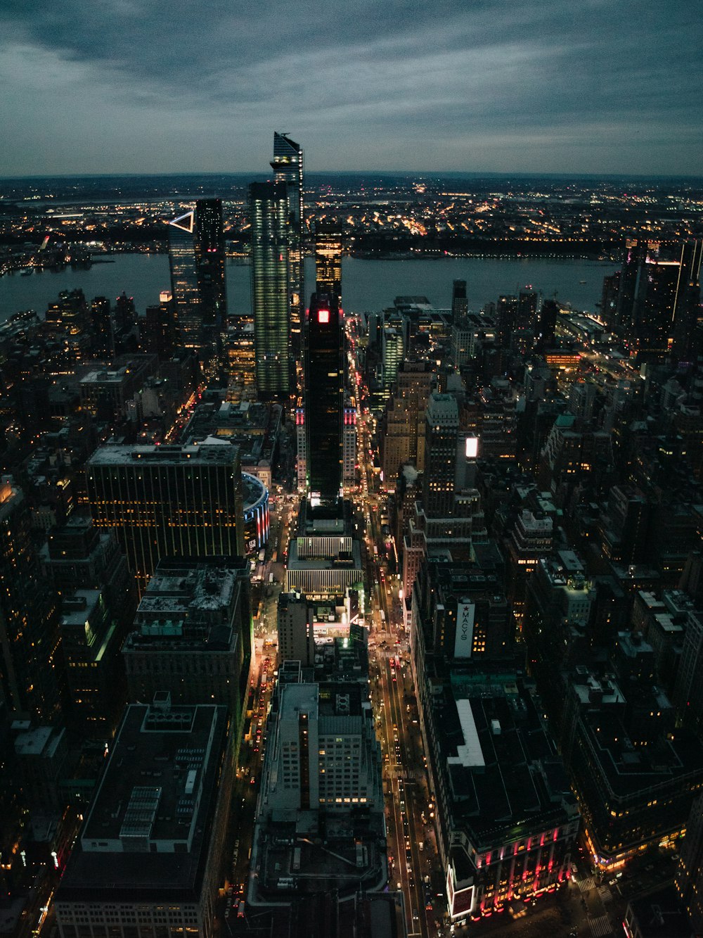 a view of a city at night from the top of a building