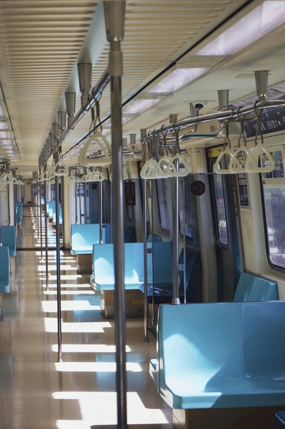 a train car filled with lots of blue seats