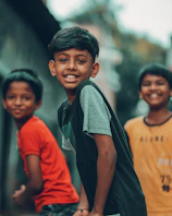 a group of young boys standing next to each other