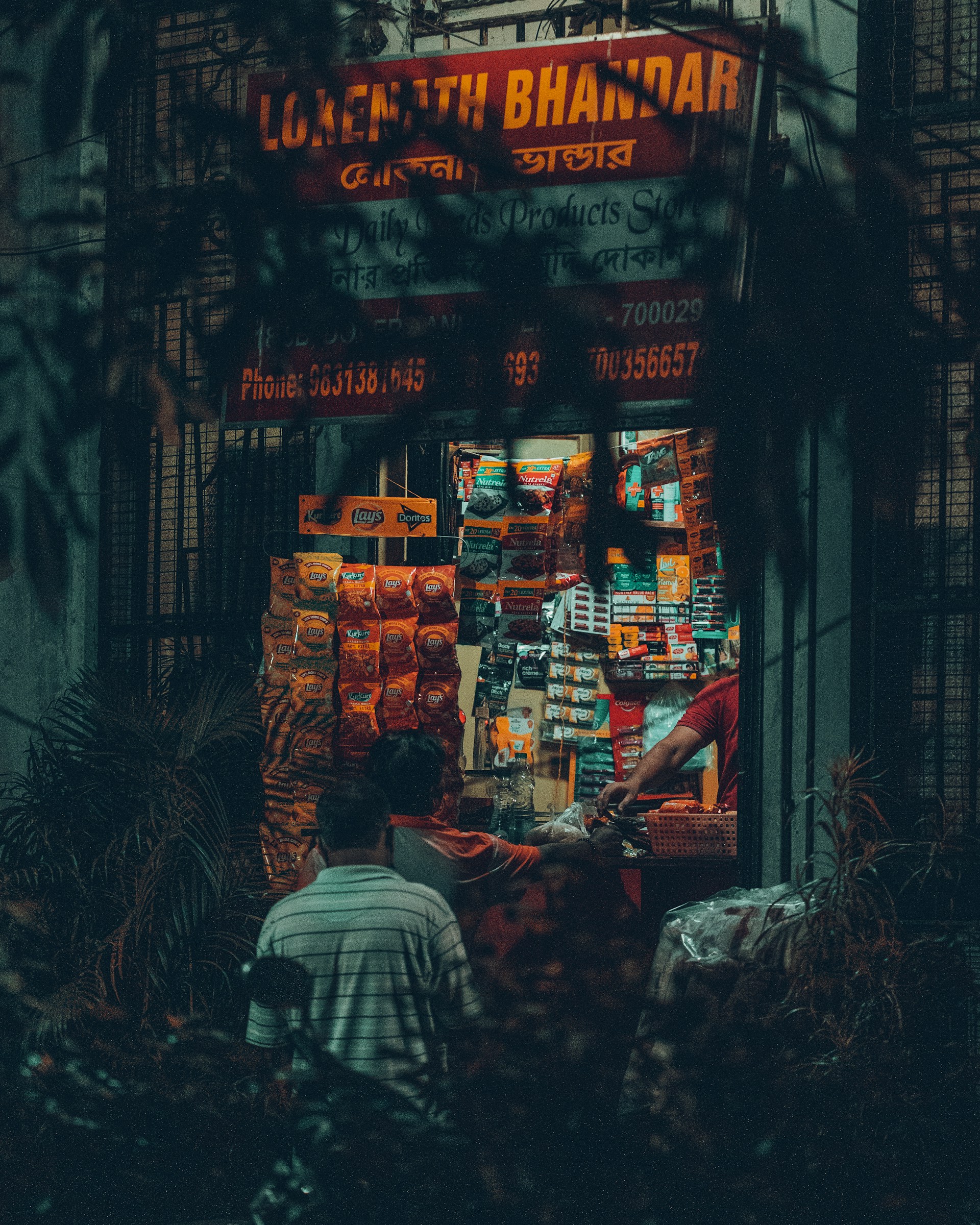 a man standing in front of a store