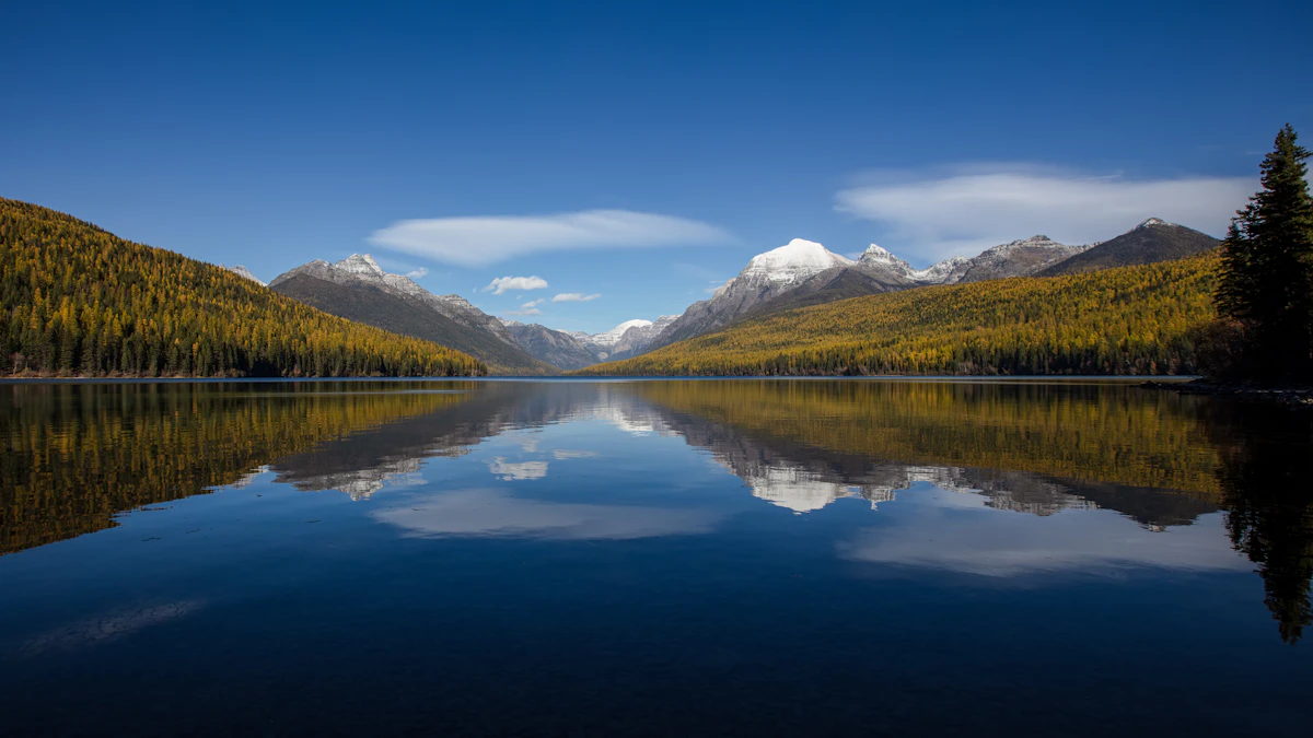 Mountain lake surrounded by forest and peaks in the Flathead Valley, Montana