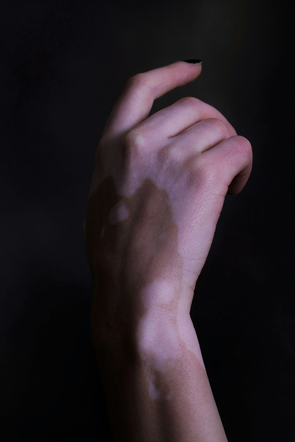 a person's hand with a lot of white powder on it