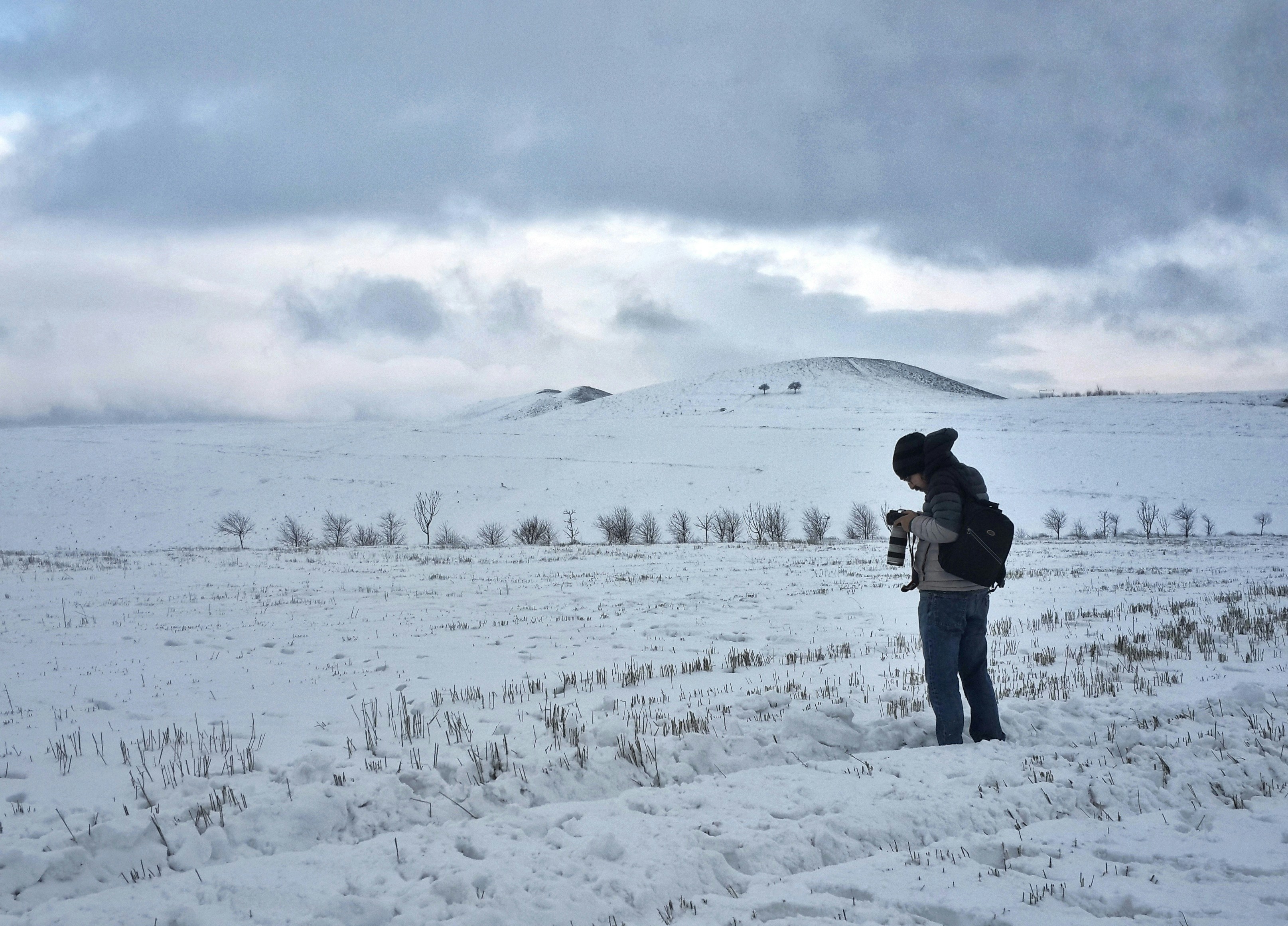 An Iranian photographer is taking capture a snowy landscape in Alamut