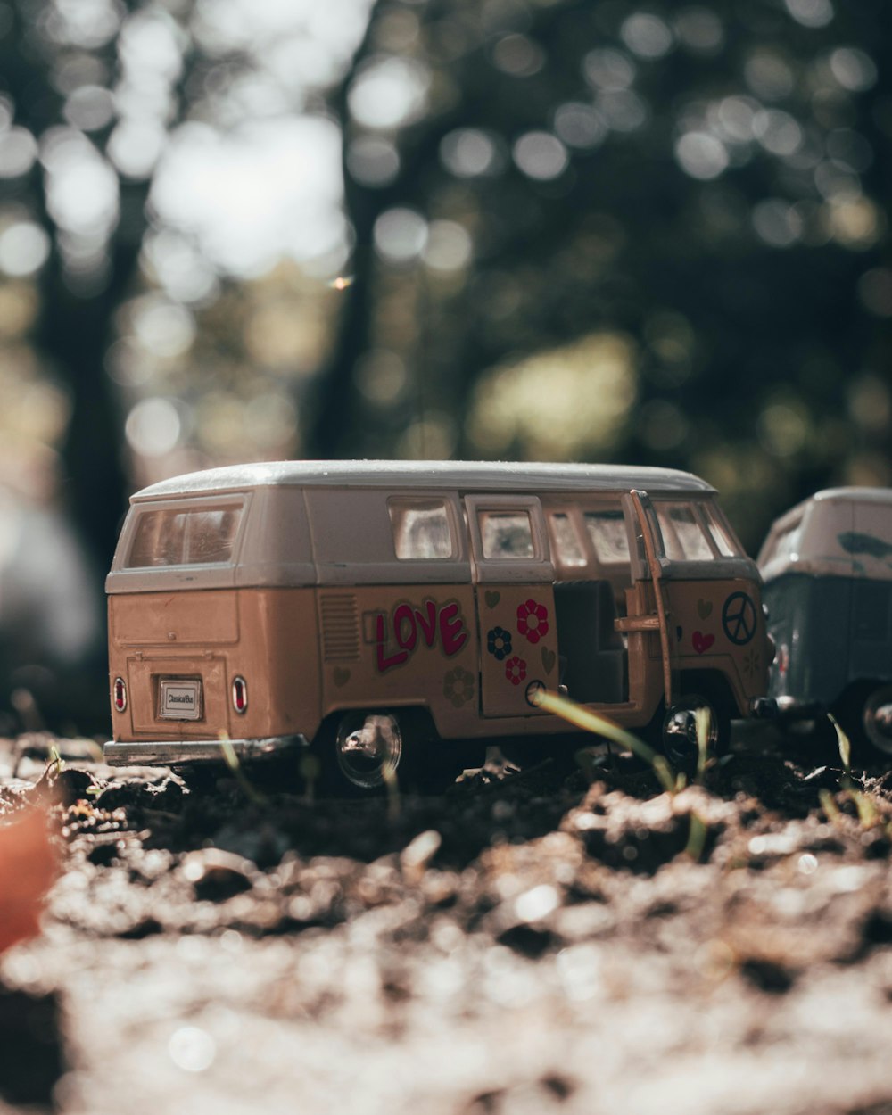 a toy van is parked in the dirt