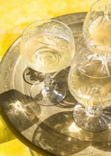 Array of polystyrene crystal glasses featuring colorful personalized prints for events.