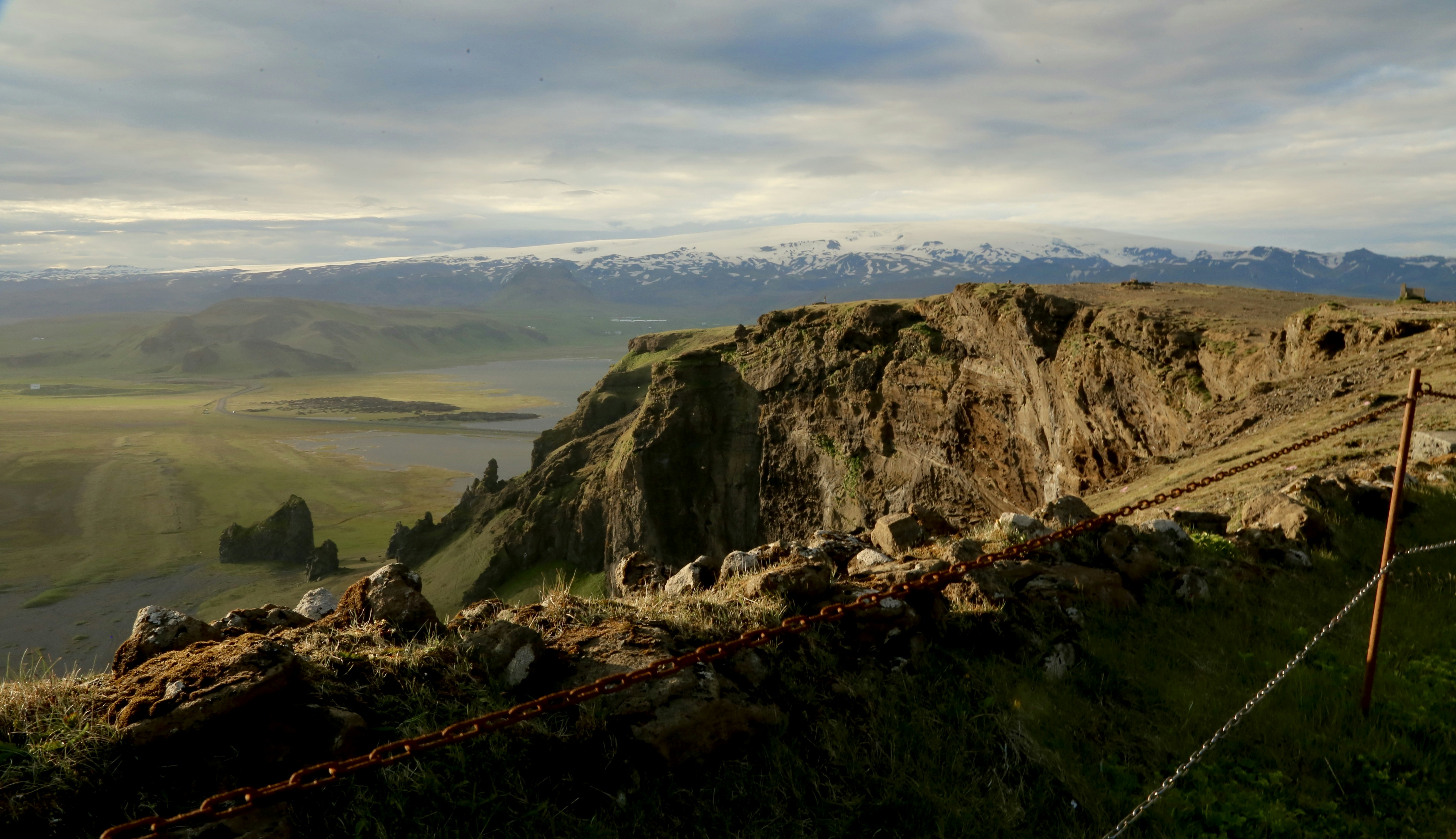 a view of a mountain range with a lake in the distance