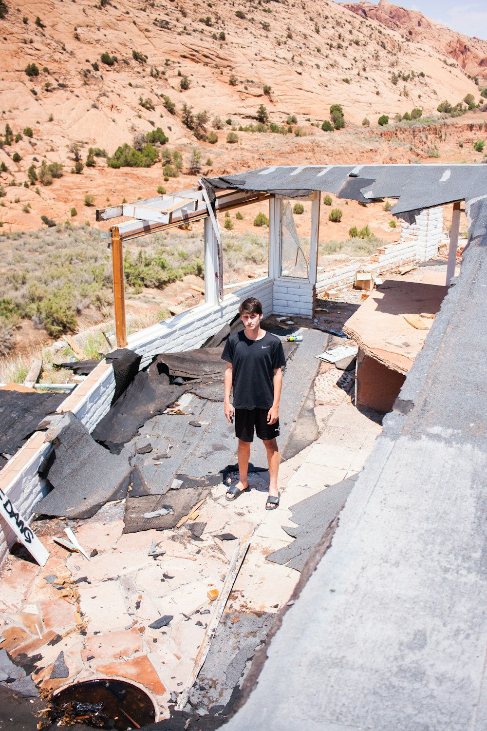 a man standing on the roof of a building