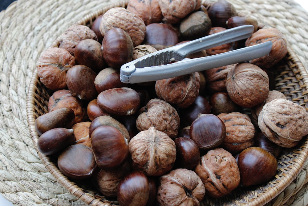 a basket filled with nuts and a hair clip