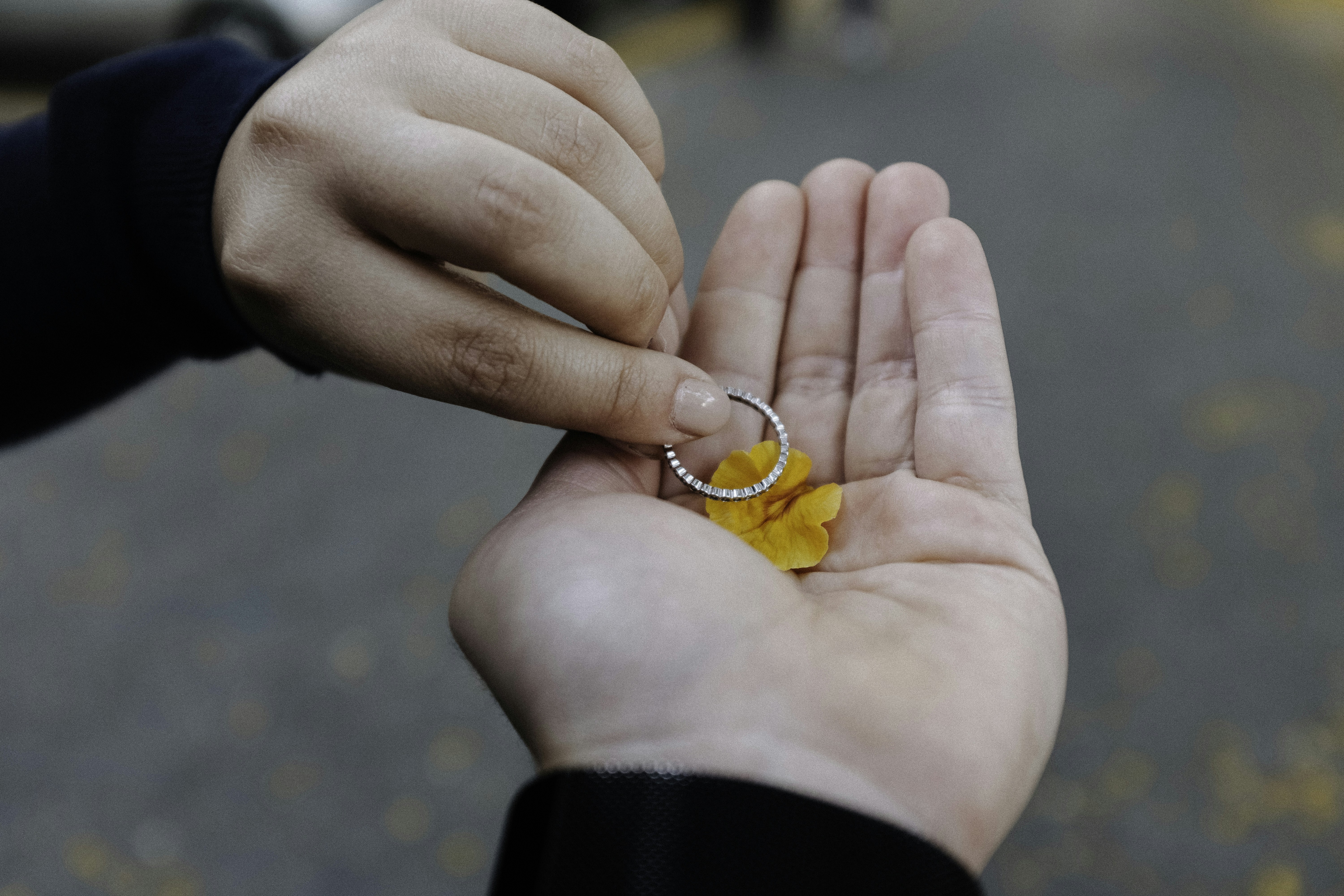 Pickleball player measuring paddle grip size with hands, demonstrating proper technique for selecting ideal racket