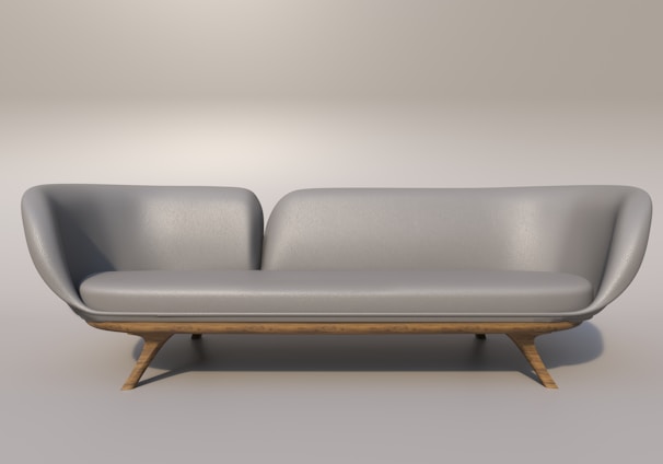 a gray couch with a wooden base on a gray background