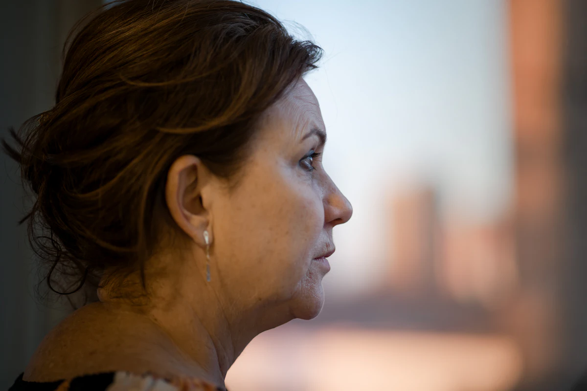 Profile of a woman showing the natural contour of her cheek and jawline in soft window light