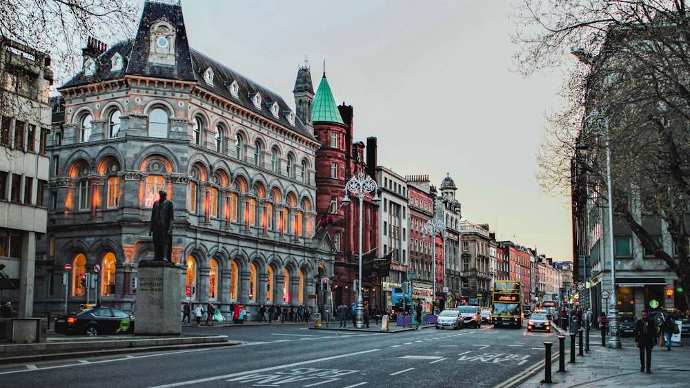 a city street with a clock tower in the middle of it