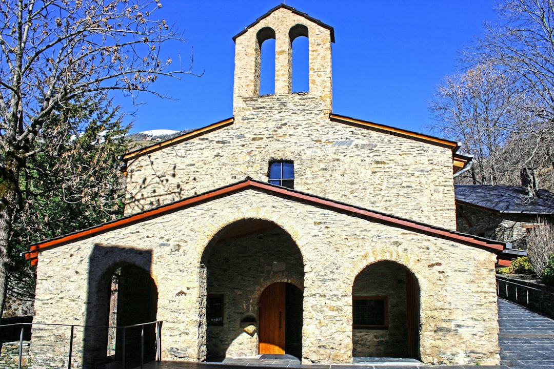 an old church with a bell tower and a steeple,
