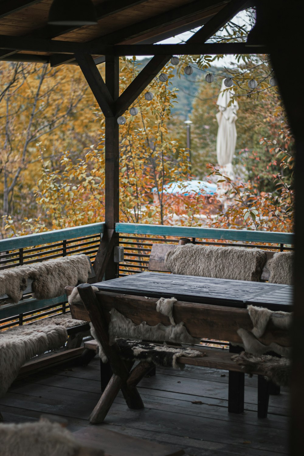 a wooden bench sitting on top of a wooden deck