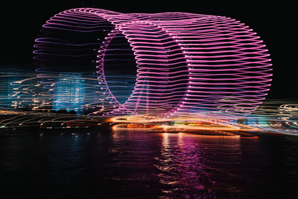 a large circular structure that is lit up at night