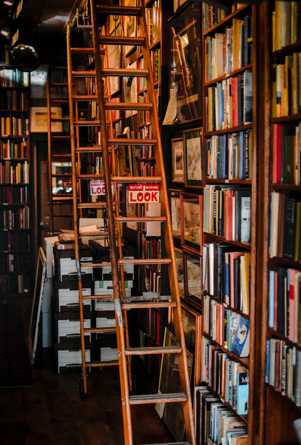 a ladder leaning against a bookshelf filled with books