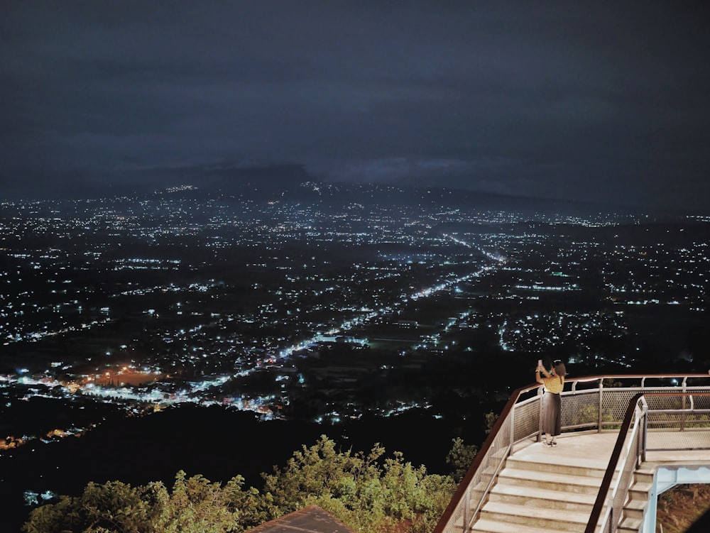 a night view of a city from a hill