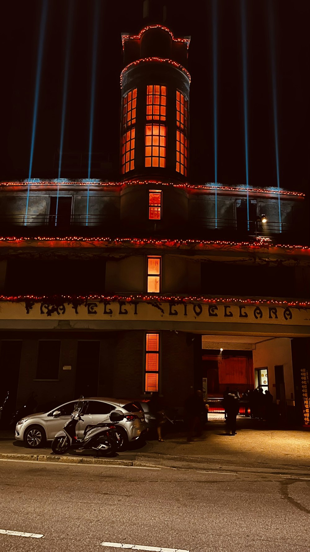 a car parked in front of a tall building