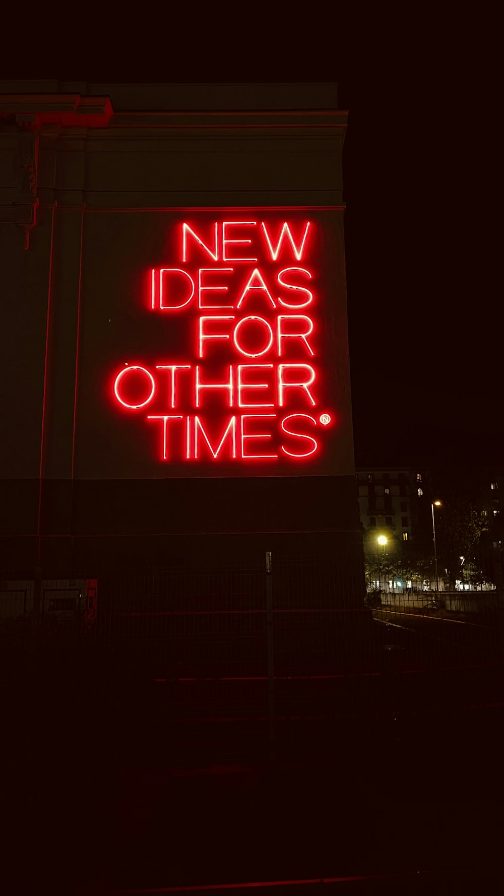 a neon sign that reads new ideas for other times