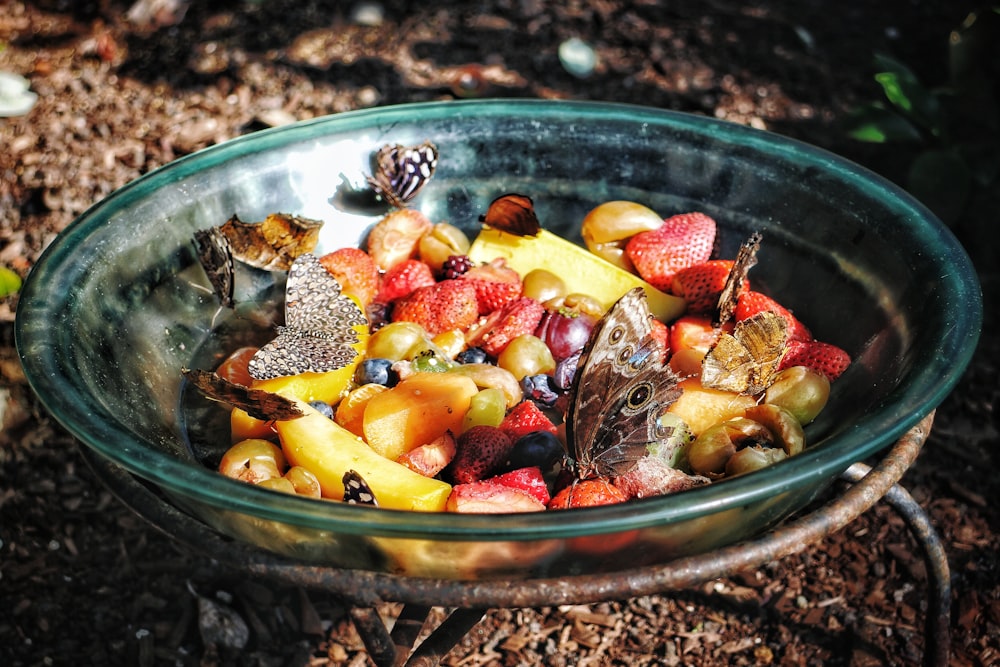 a bowl filled with lots of different types of fruit