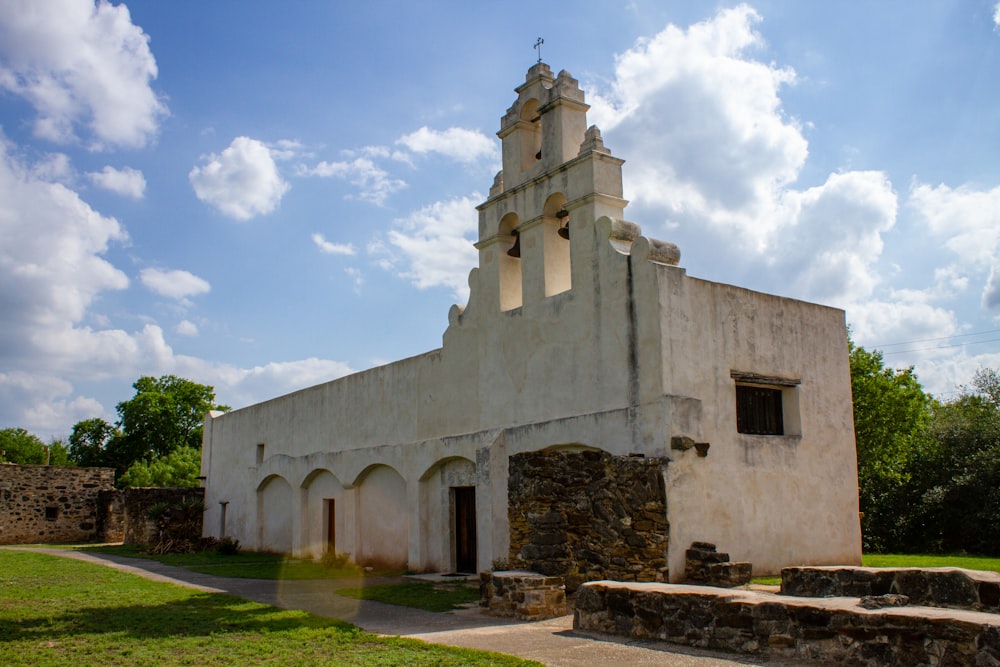 a church with a tall steeple and a clock tower