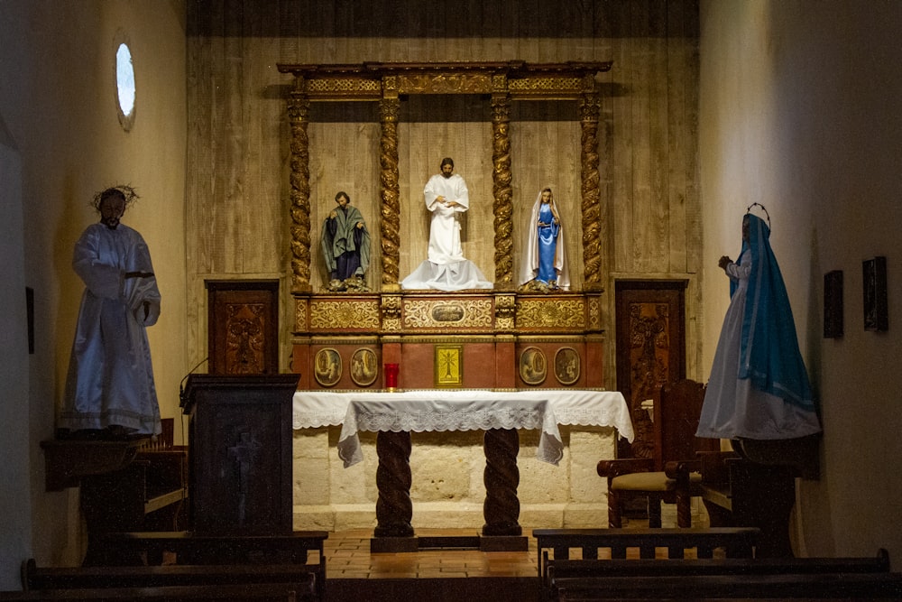 a statue of a woman standing in front of a alter