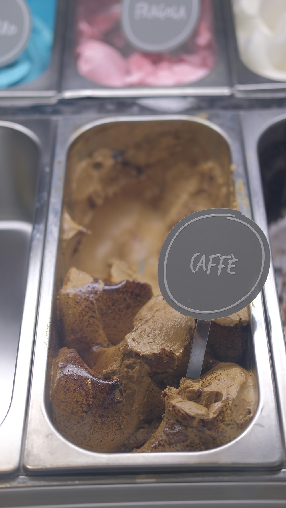 a display case filled with different types of desserts