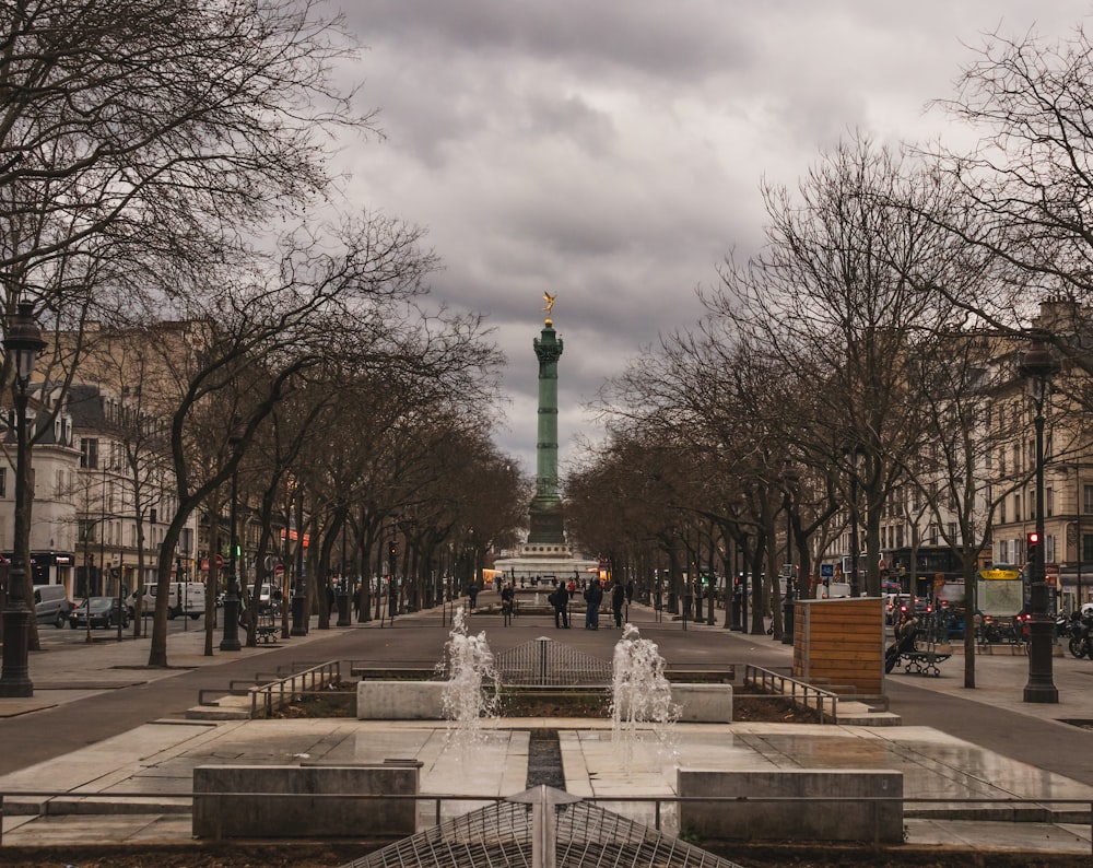 a view of a park with a fountain in the middle of it