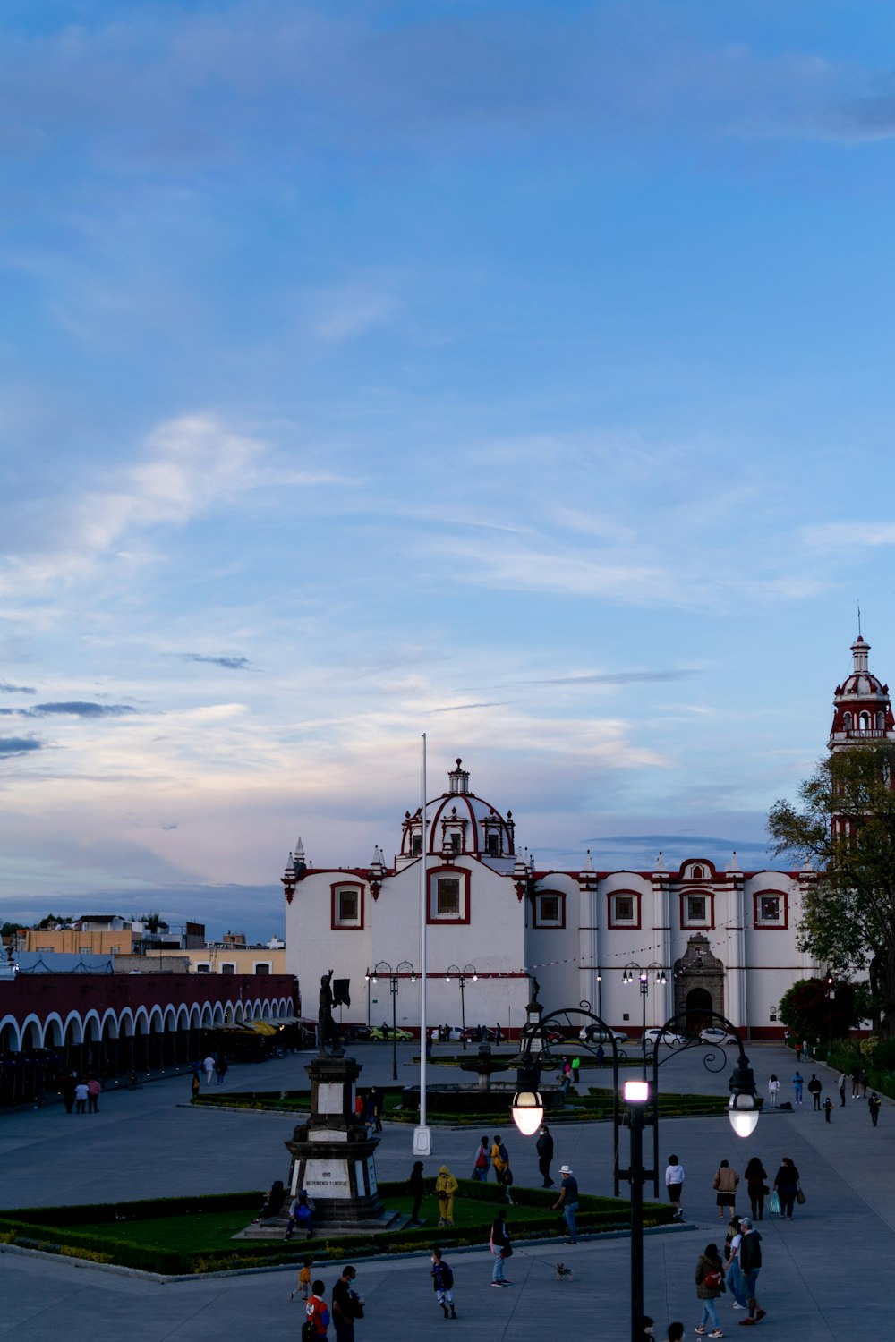 a large white building with a clock tower