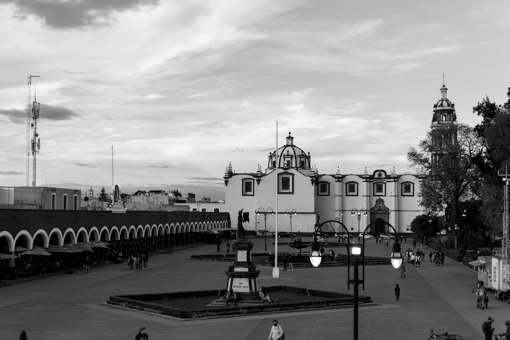 a black and white photo of a city square