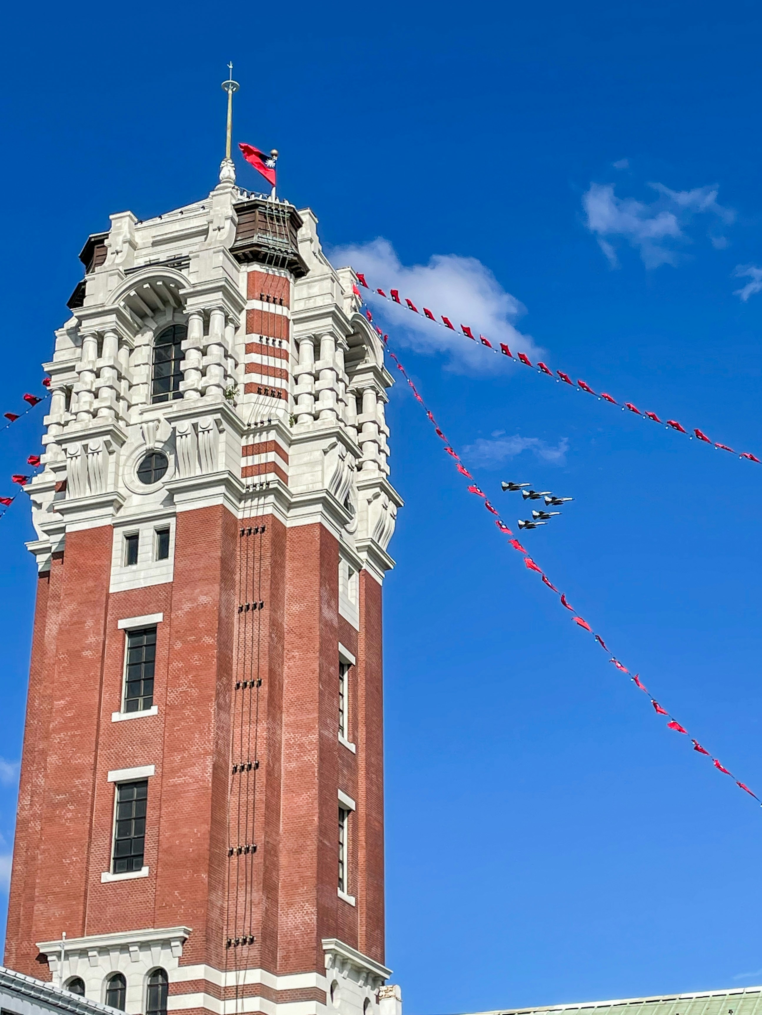 a tall tower with a clock on the top of it