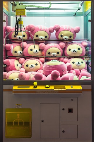 a bunch of stuffed animals in a display case