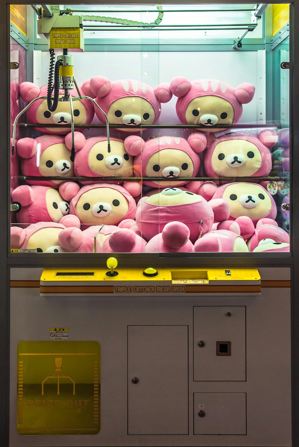 a bunch of stuffed animals in a display case