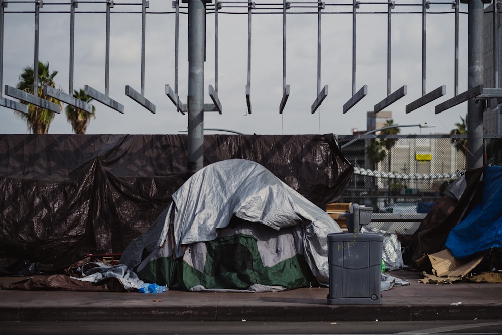 a pile of garbage sitting on the side of a road