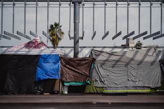 a group of tents sitting on top of a sidewalk