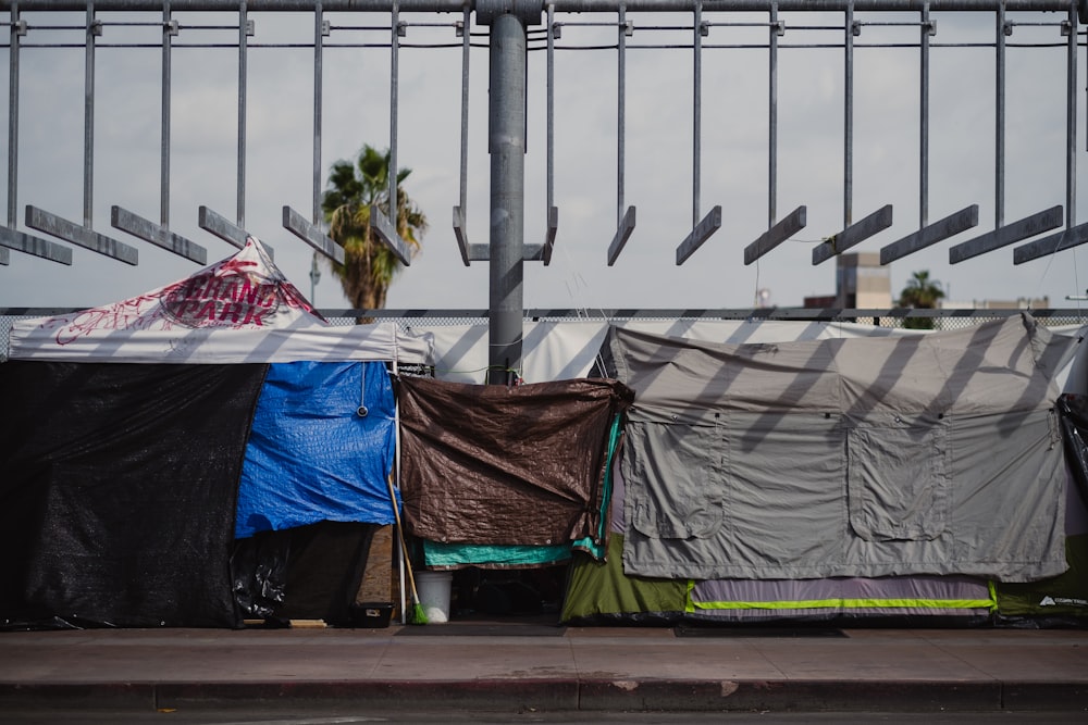 a group of tents sitting on top of a sidewalk