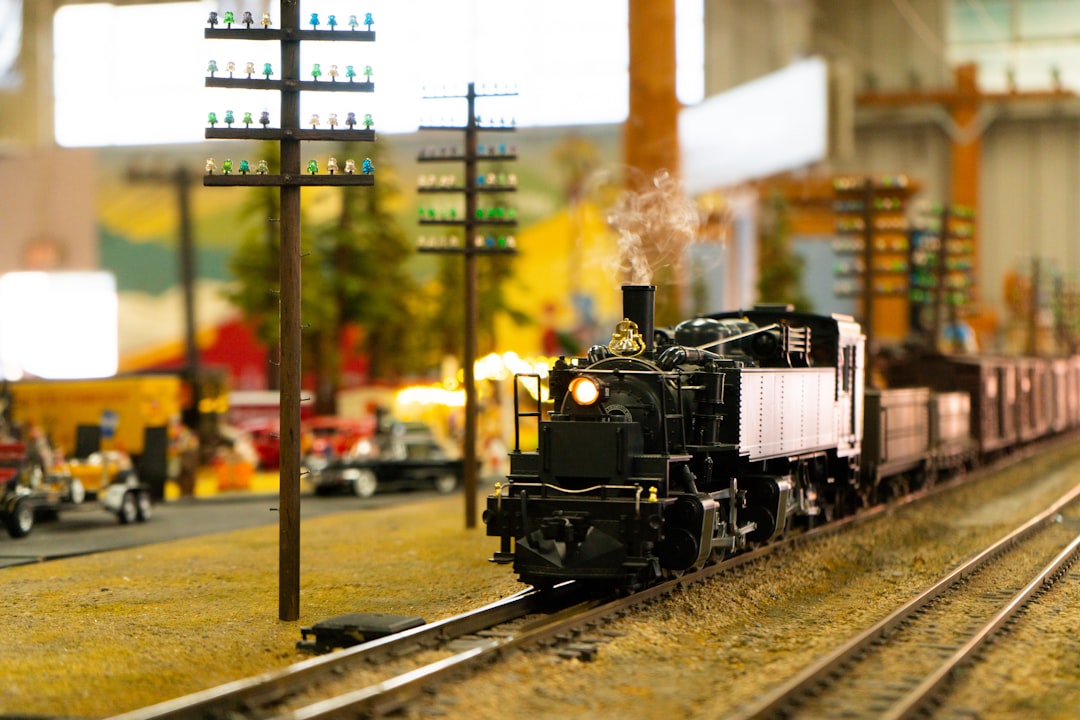 a toy train is on the tracks in a toy town,