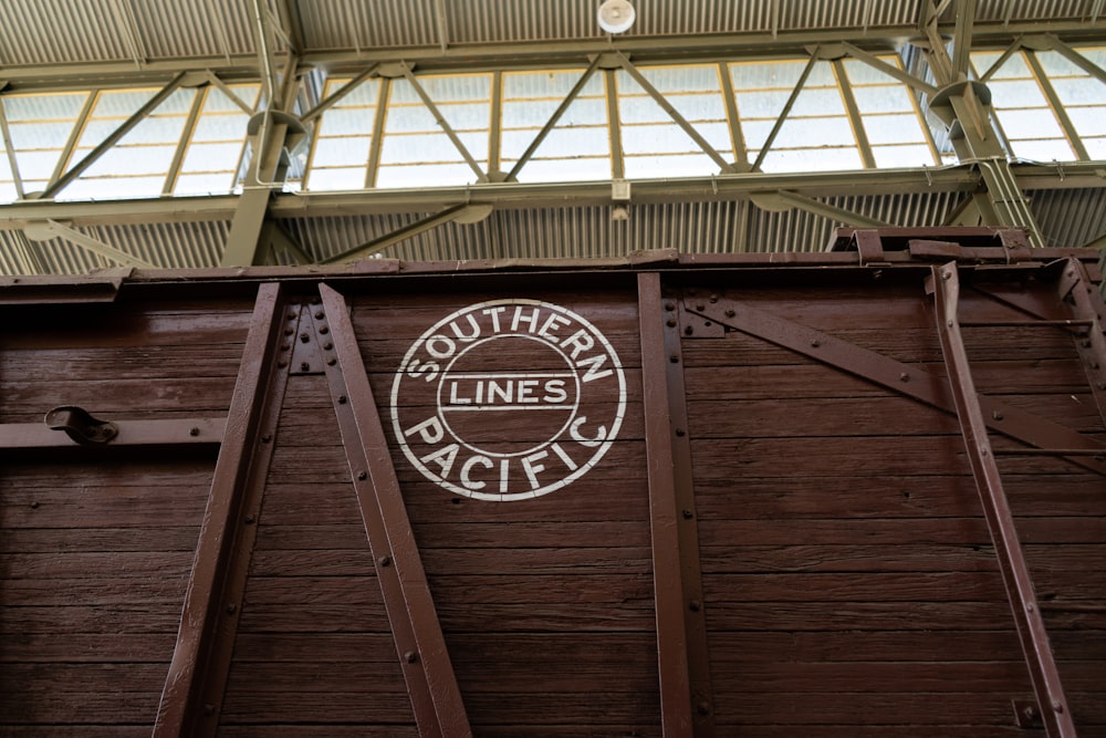 a sign on the side of a wooden building