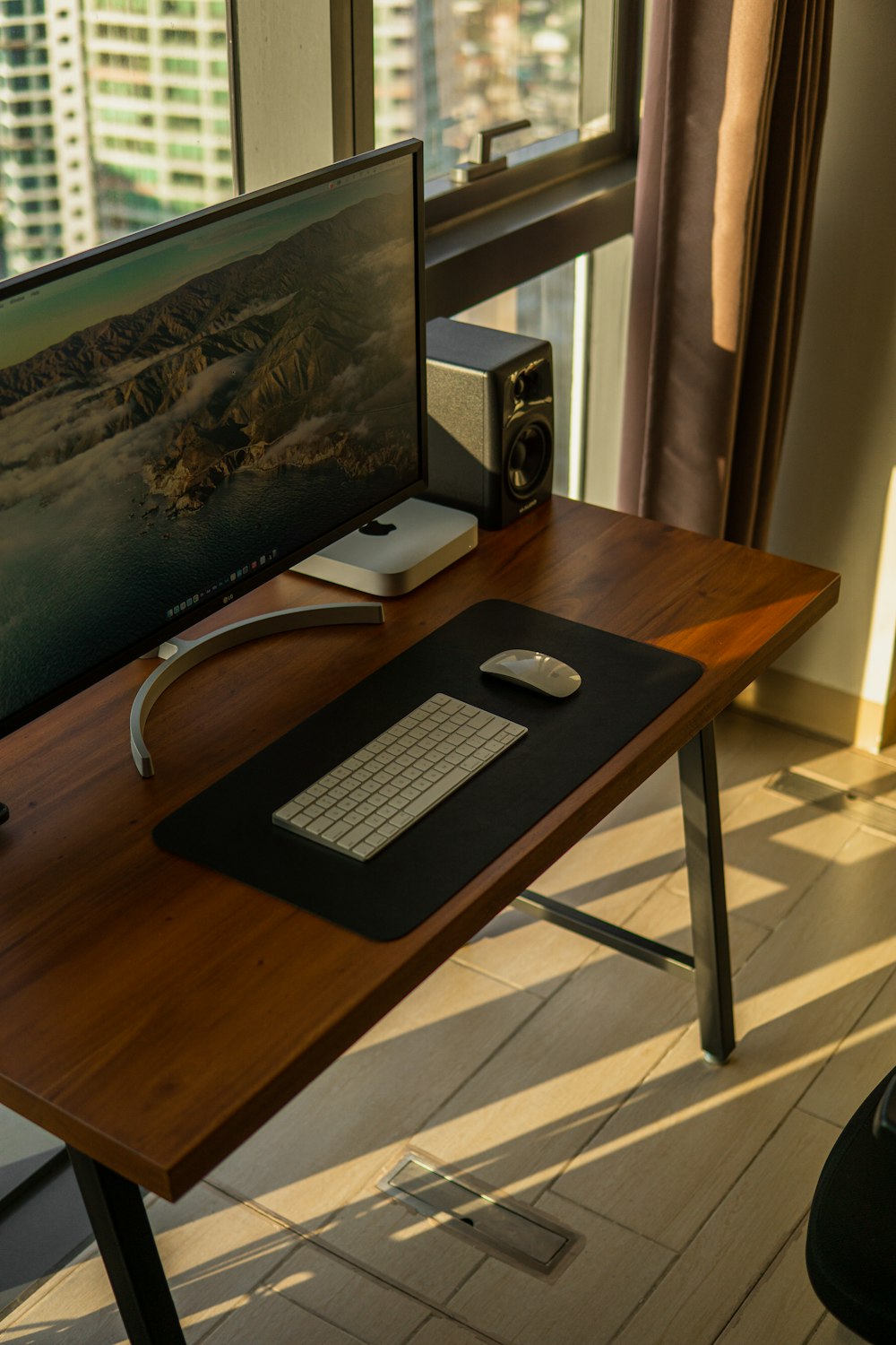 a wooden desk with a computer on top of it