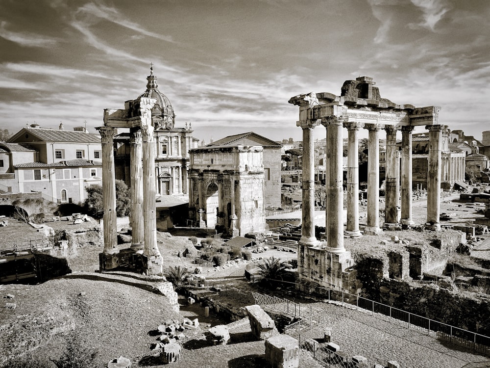 a black and white photo of ruins in a city