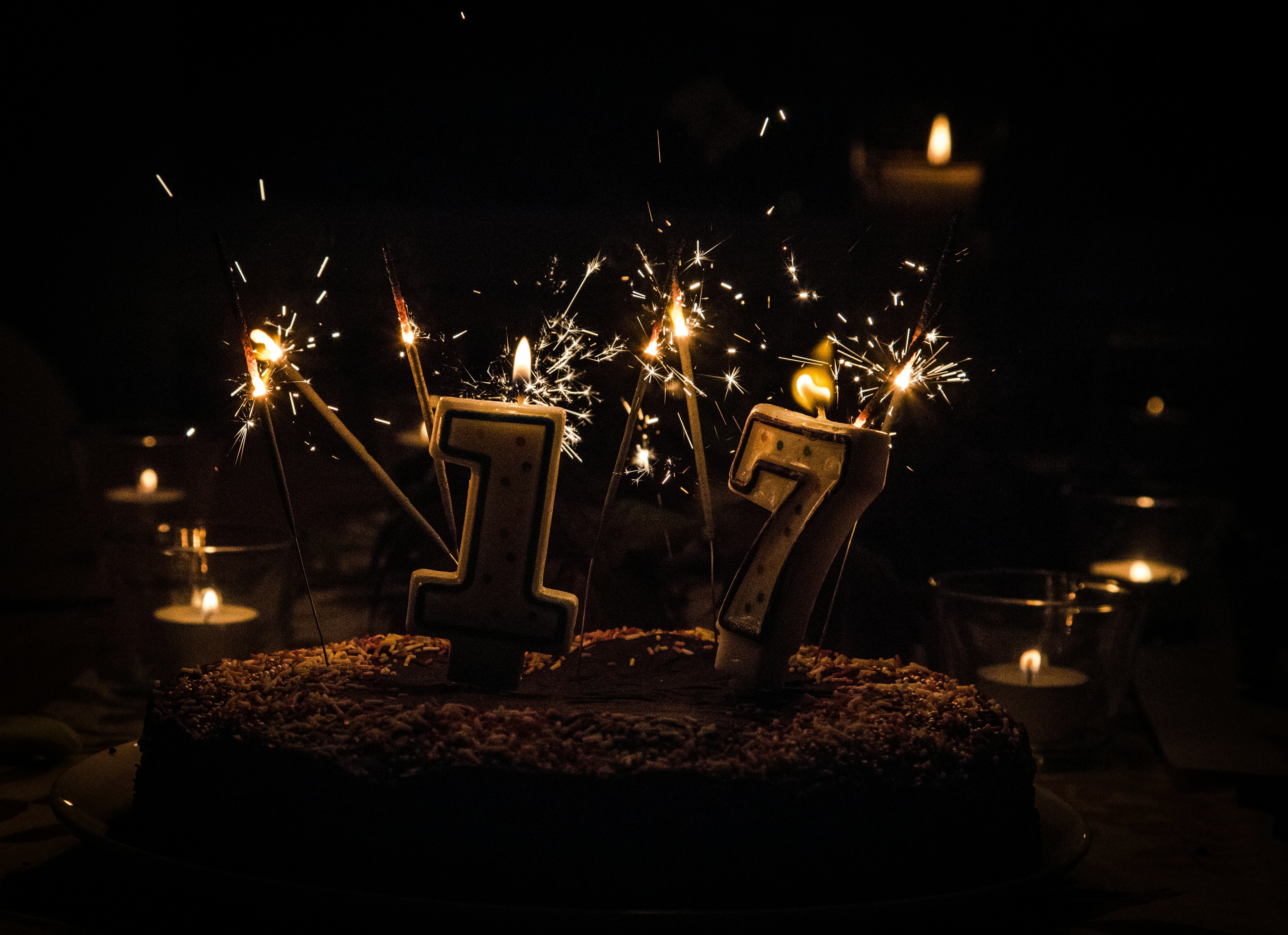 a birthday cake with sparklers and candles