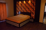 A bright bedroom featuring a bed dressed in vibrant patterned sheets from WeCare.